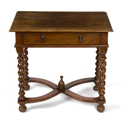 Lot 879 - An oak table on spiral turned legs and X...