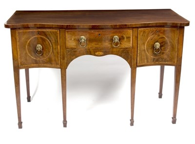 Lot 900 - A George III mahogany serpentine sideboard...