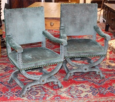 Lot 931 - A pair of 17th Century style armchairs covered...