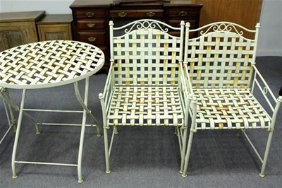 Lot 935 - A set of white painted metal garden furniture...