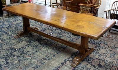 Lot 936 - An oak refectory type table on shaped end...