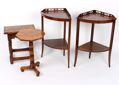 Lot 938 - A pair of two-tier tables with pierced backs,...