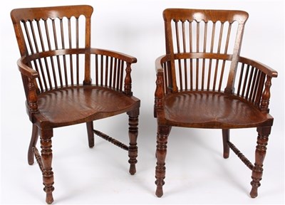Lot 943 - A pair of oak stick back chairs with solid...