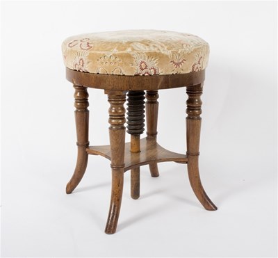 Lot 946 - A circular piano stool, with adjustable top on...