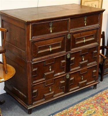 Lot 951 - A 17th Century oak chest of four drawers with...