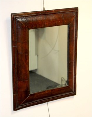 Lot 957 - A William IV walnut cushion-shaped mirror...