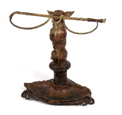 Lot 959 - A painted cast iron stick stand, a fox...