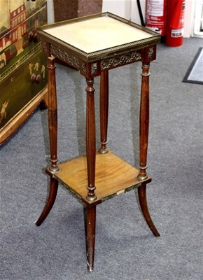 Lot 960 - A marble top walnut jardiniere stand with gilt...