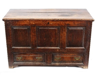 Lot 963 - A George III oak mule chest, the fielded panel...