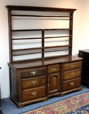 Lot 973 - Lot Withdrawn - An oak dresser with shelves...