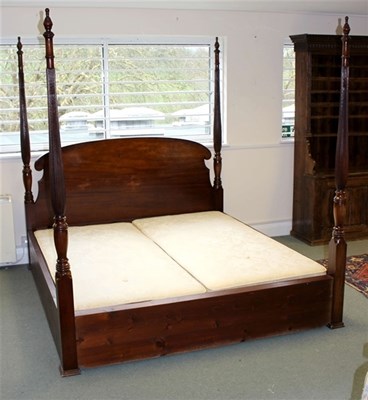 Lot 986 - A modern four-poster bed with reeded uprights