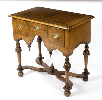 Lot 988 - A reproduction walnut lowboy, 76cm wide