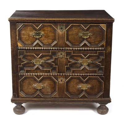 Lot 995 - A 17th Century oak chest with three panelled...