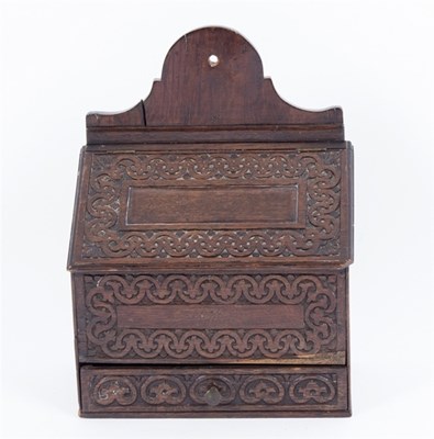 Lot 998 - An oak candle box with carved front, hinged...