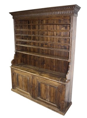Lot 1000 - A 19th Century dresser with closed rack above...