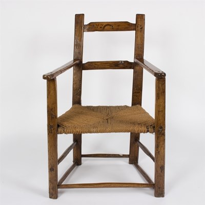 Lot 1008 - A primitive oak 18th Century chair with strung...