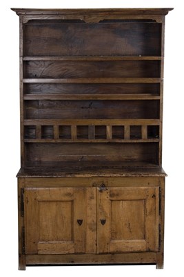 Lot 1013 - An 18th Century fruitwood dresser with closed...