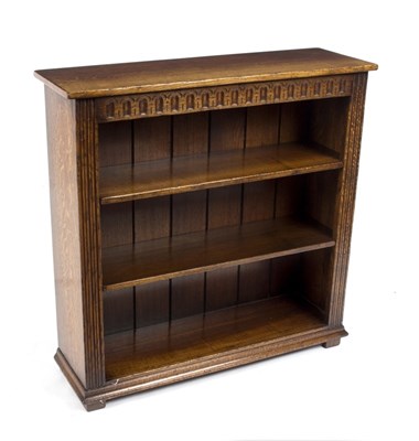 Lot 1015 - An oak bookcase, bearing label of Titchmarsh &...