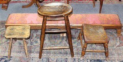 Lot 1020 - A stool with oval elm seat, 36cm wide, two low...