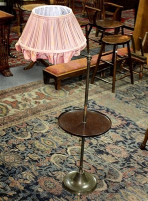 Lot 1021 - An adjustable standard reading lamp with...