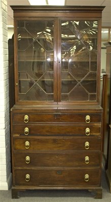 Lot 1024 - A George III mahogany secretaire bookcase, the...
