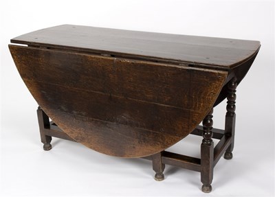Lot 1028 - A late 17th Century oak gateleg table, on reel...