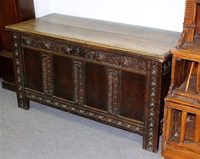 Lot 1032 - An 18th Century oak coffer, the quadruple...