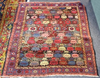 Lot 1046 - A Hamadan rug with all over floral design,...