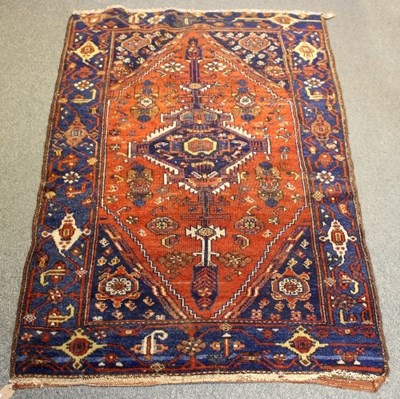 Lot 1049 - An Eastern rug with central medallion to a red...