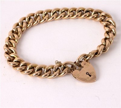 Lot 5 - A 9ct gold curb link bracelet with...