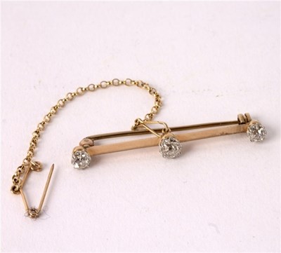 Lot 10 - A diamond bar brooch, set with old cut stones...