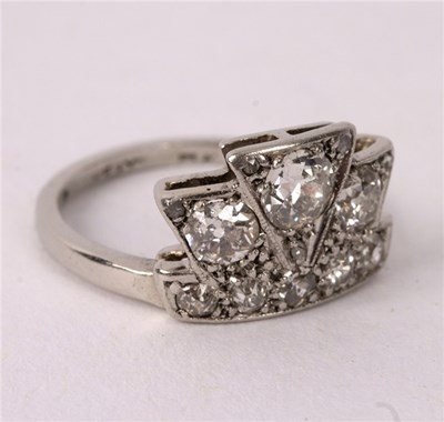 Lot 18 - An Art Deco diamond ring of stylised coronet...