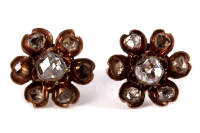 Lot 34 - A pair of diamond flowerhead ear studs, set...