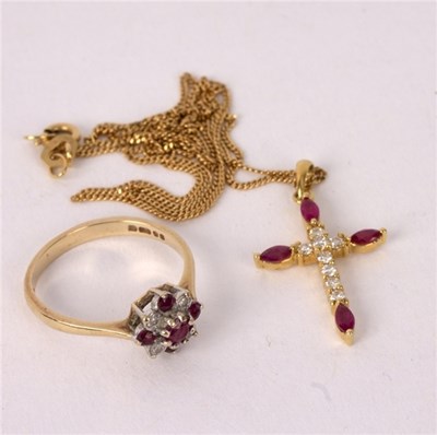 Lot 45 - A diamond and ruby cross set in 18K gold to an...