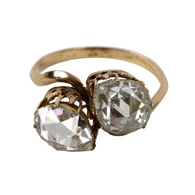 Lot 47 - A diamond crossover ring, the two pear-shaped...