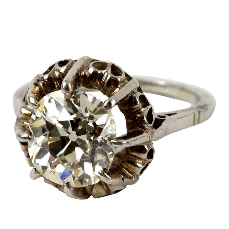 Lot 48 - A solitaire diamond ring, the cushion shaped...