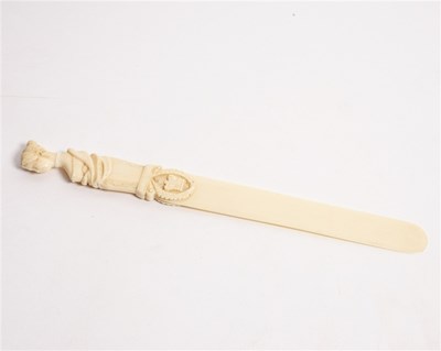 Lot 138 - A French ivory page turner, the handle carved...