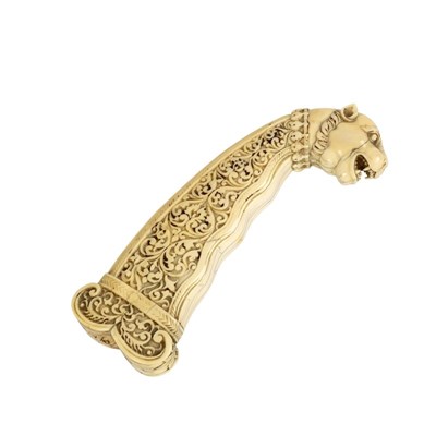 Lot 144 - A Moghul carved ivory dagger handle, circa...