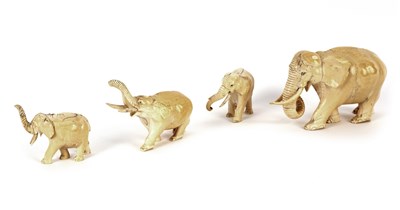 Lot 151 - A set of four Anglo-Indian ivory elephants,...