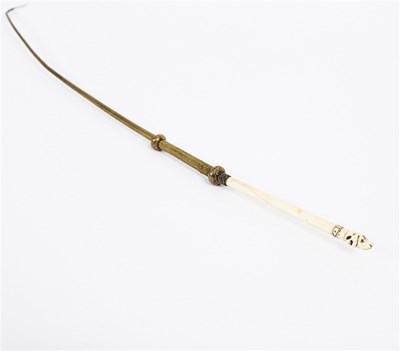 Lot 164 - A plaited brass riding whip, the ivory handle...