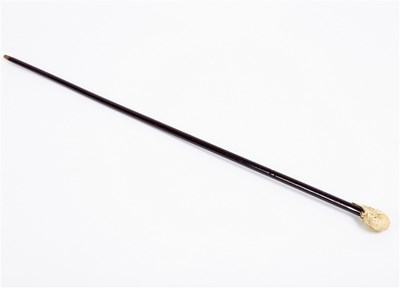 Lot 171 - A lacquered walking stick, with carved ivory...