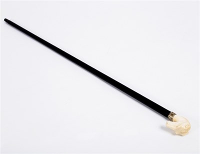 Lot 173 - An ebonised walking stick, the ivory handle...