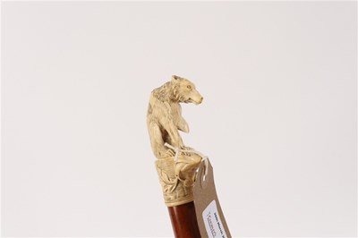 Lot 183 - A malacca stick, the ivory handle carved a...