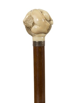 Lot 184 - A walking stick with silver collar and carved...