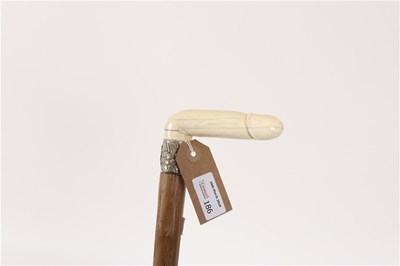 Lot 186 - A wooden walking stick with erotic carved...