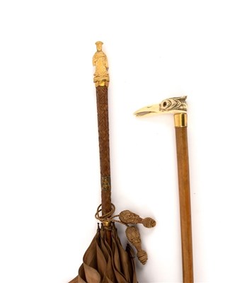 Lot 198 - Two parasols, one with bird beak handle, the...