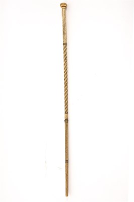 Lot 200 - A whalebone walking stick with twist turned...