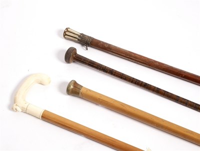 Lot 204 - A malacca walking stick, the ivory handle...