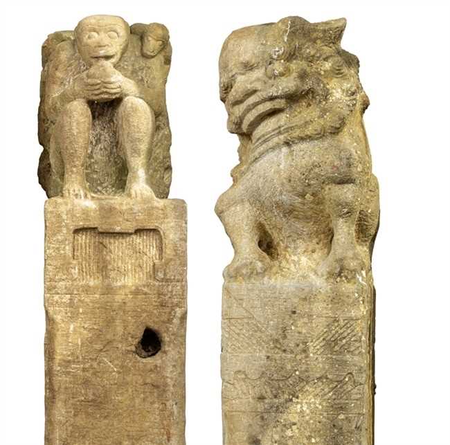 Lot 340 - Two Chinese carved stone hitching posts with...