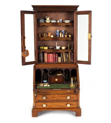 Lot 437 - An apprentice miniature bureau bookcase, 56cm...